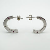 Profile shot showing butterfly posts and full curvature of each chunky hoop