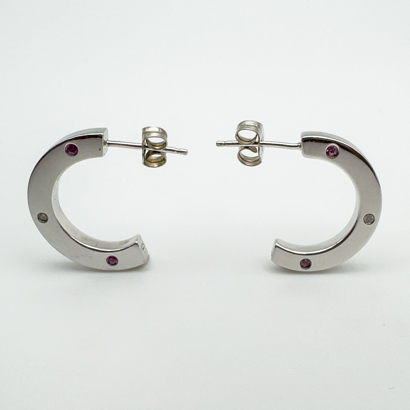Profile shot showing butterfly posts and full curvature of each chunky hoop