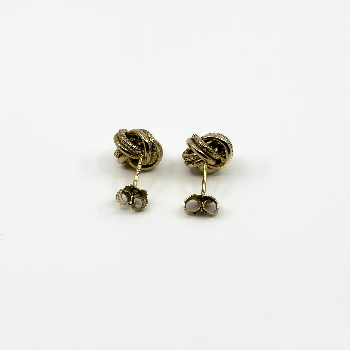Back view of vintage 9ct gold knot stud earrings with butterfly backs