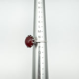 Vintage carnelian solitaire ring shown on ring mandrel at UK size O