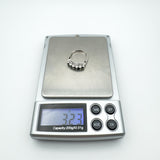 Sterling silver sapphire ring weighing approximately 3.2g on precision scale