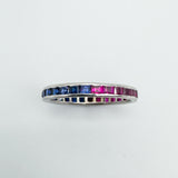 Sapphire and ruby eternity ring stacked to show both colour options