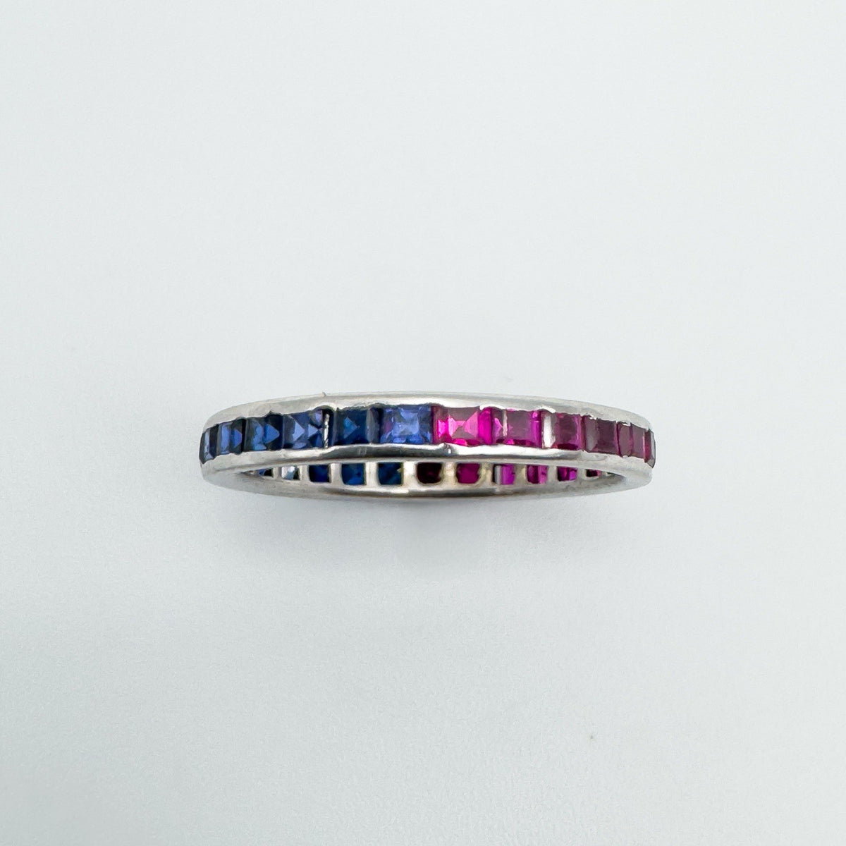 Sapphire and ruby eternity ring stacked to show both colour options