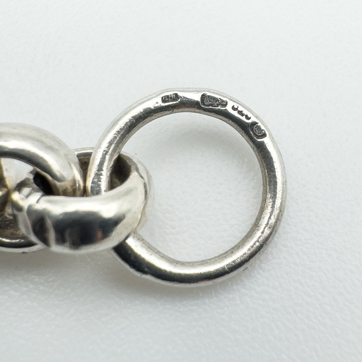 Close-up of Sheffield hallmark and maker’s mark CBL on sterling silver loop