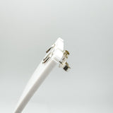 Side view of sterling silver mini horseshoe studs on display stand