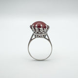 Raised profile of vintage carnelian solitaire ring in sterling silver