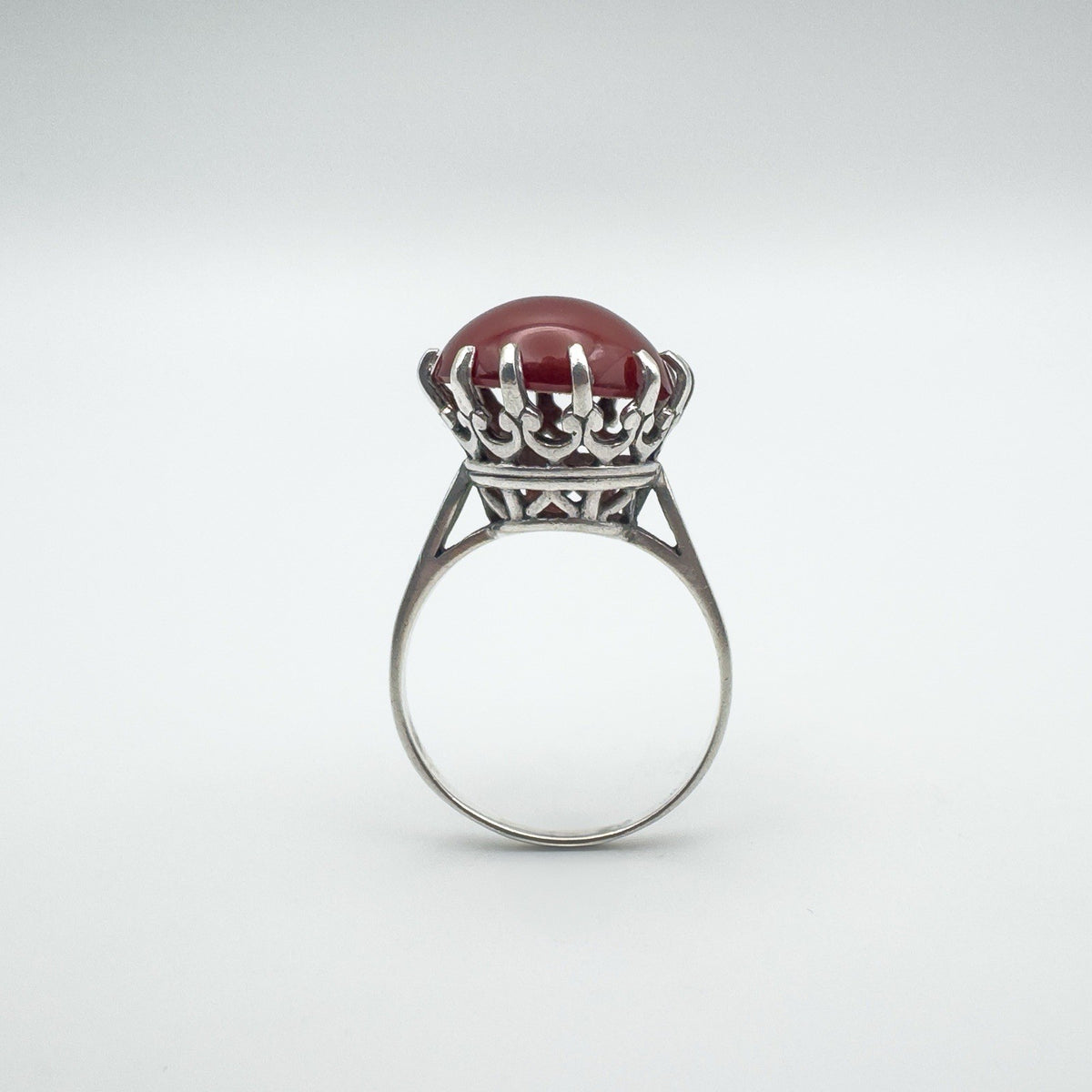 Raised profile of vintage carnelian solitaire ring in sterling silver