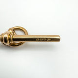 Side view of vintage 9ct gold T-bar with visible 375 and maker hallmarks