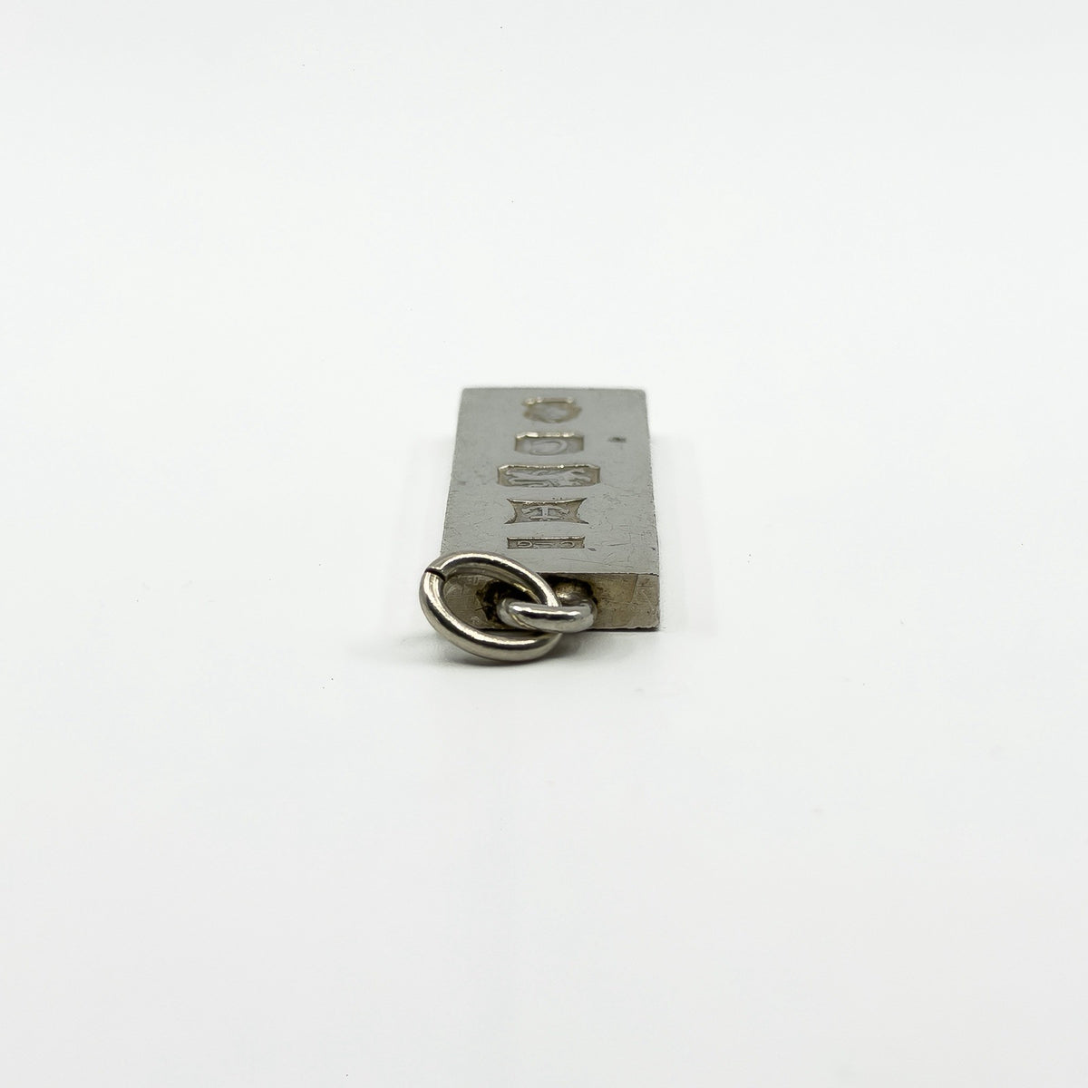 Close up of the bail and top edge on vintage sterling silver ingot pendant