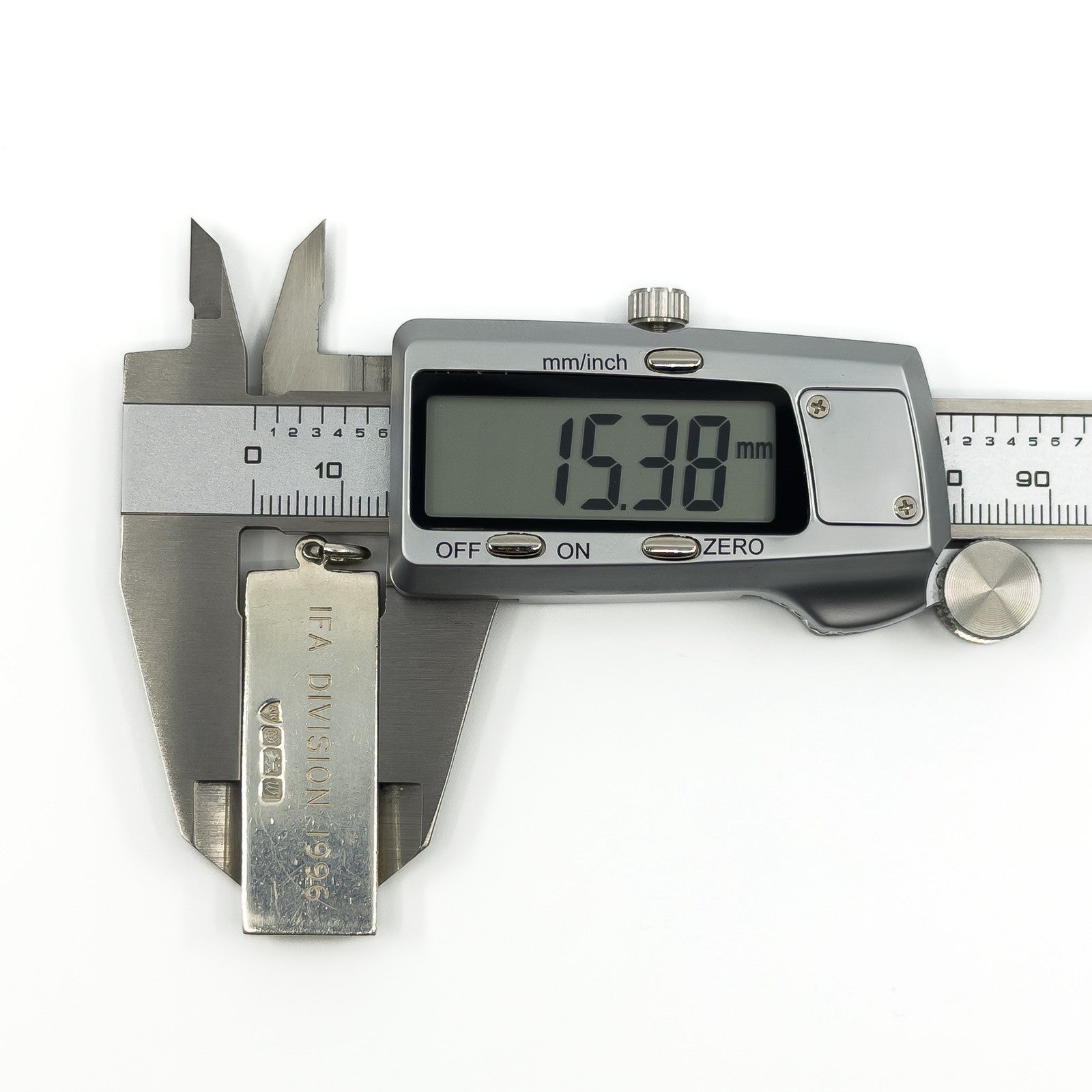 Sterling silver ingot pendant measured with calipers at approximately 15.3mm wide.