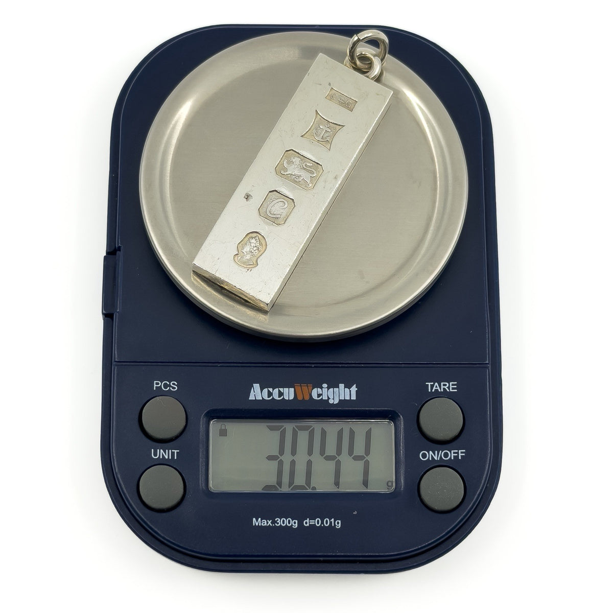 Vintage sterling silver ingot pendant shown weighing approximately 30.44g on digital scales