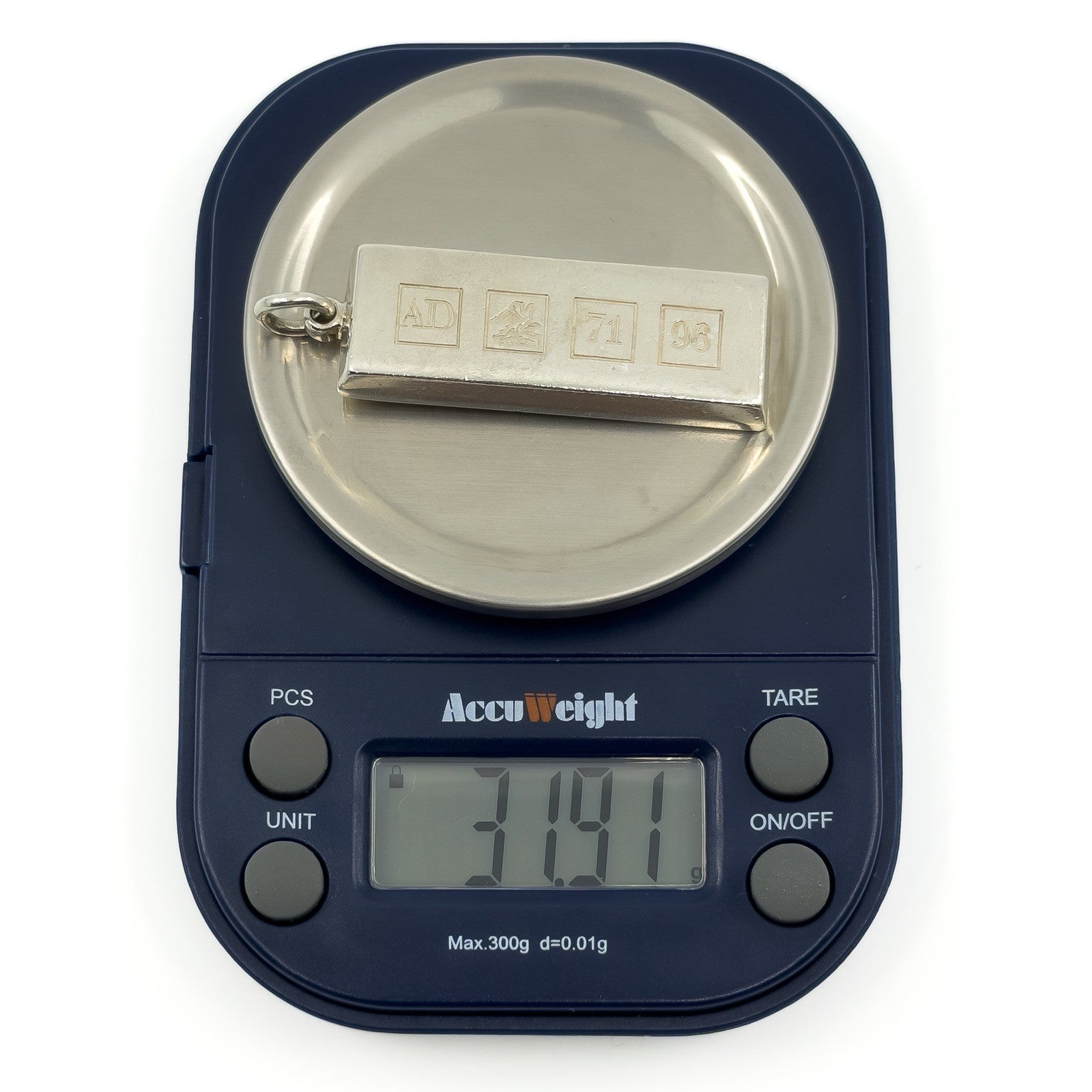 Sterling silver ingot pendant on scales showing an approximate weight of 31.9g.
