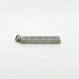 Hallmarked side of vintage sterling silver ingot pendant shown from a low angle