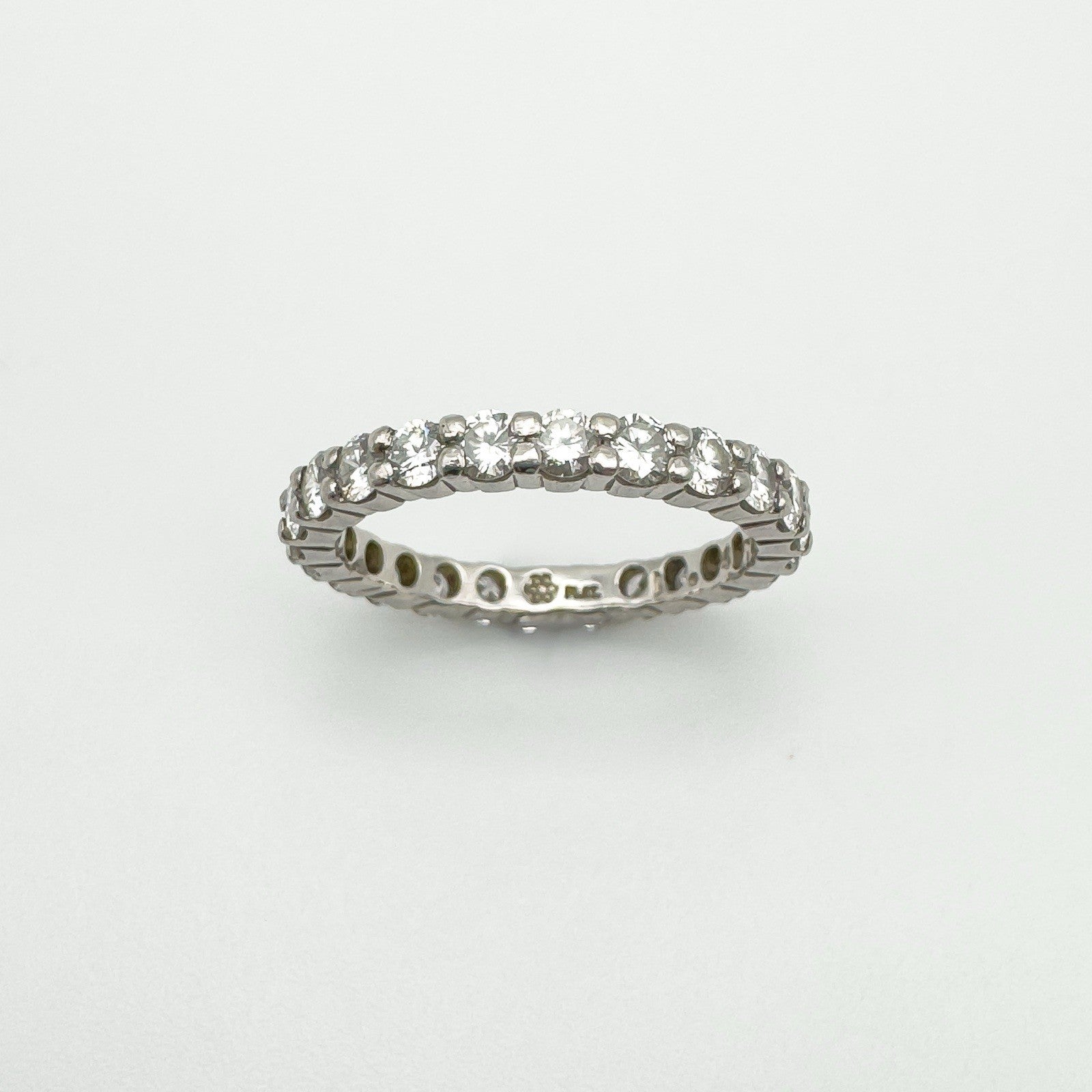 Platinum diamond eternity ring with 1.47ct natural diamonds, angled view