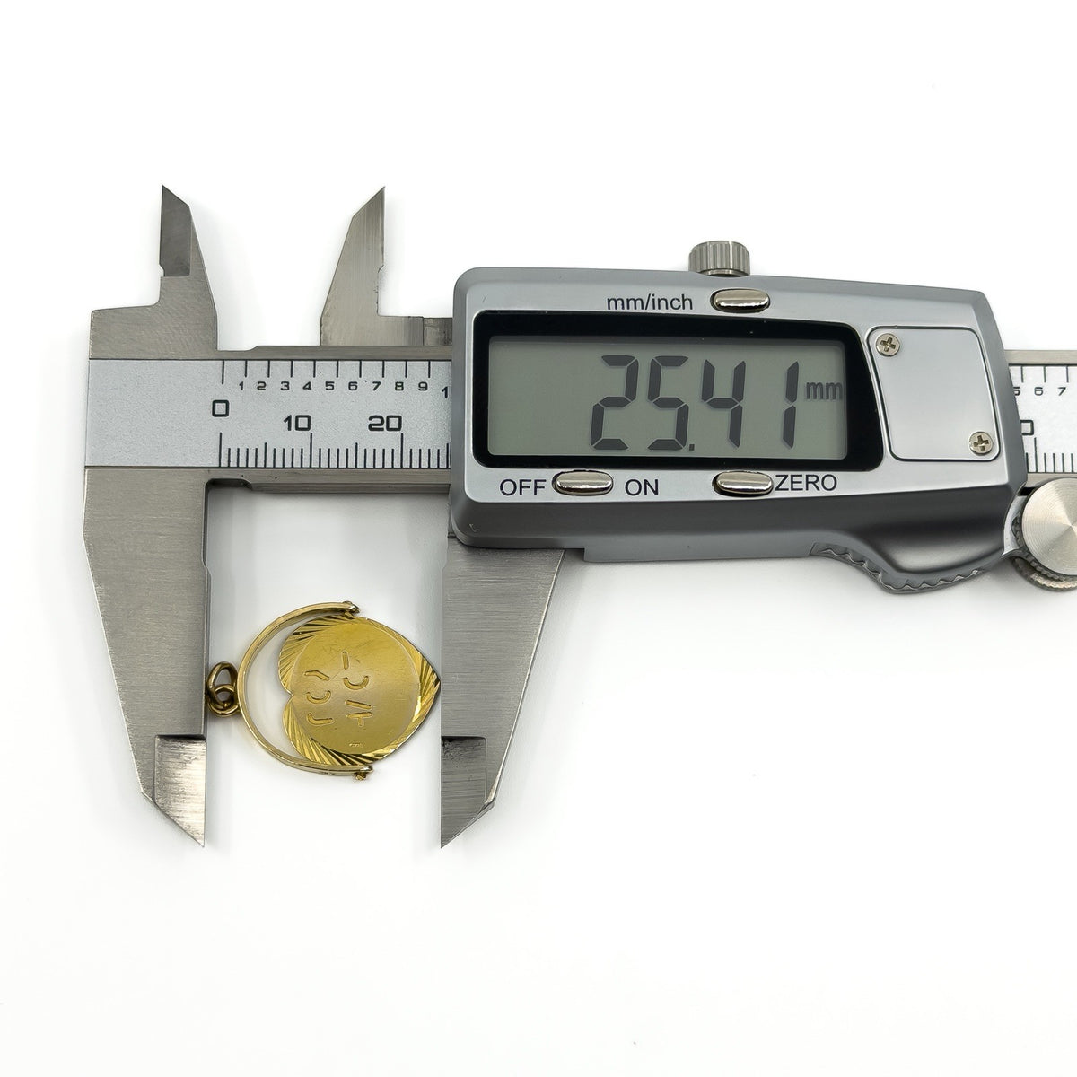 Vintage 9ct gold spinning fob pendant measured with digital calipers at approx 25.41mm long