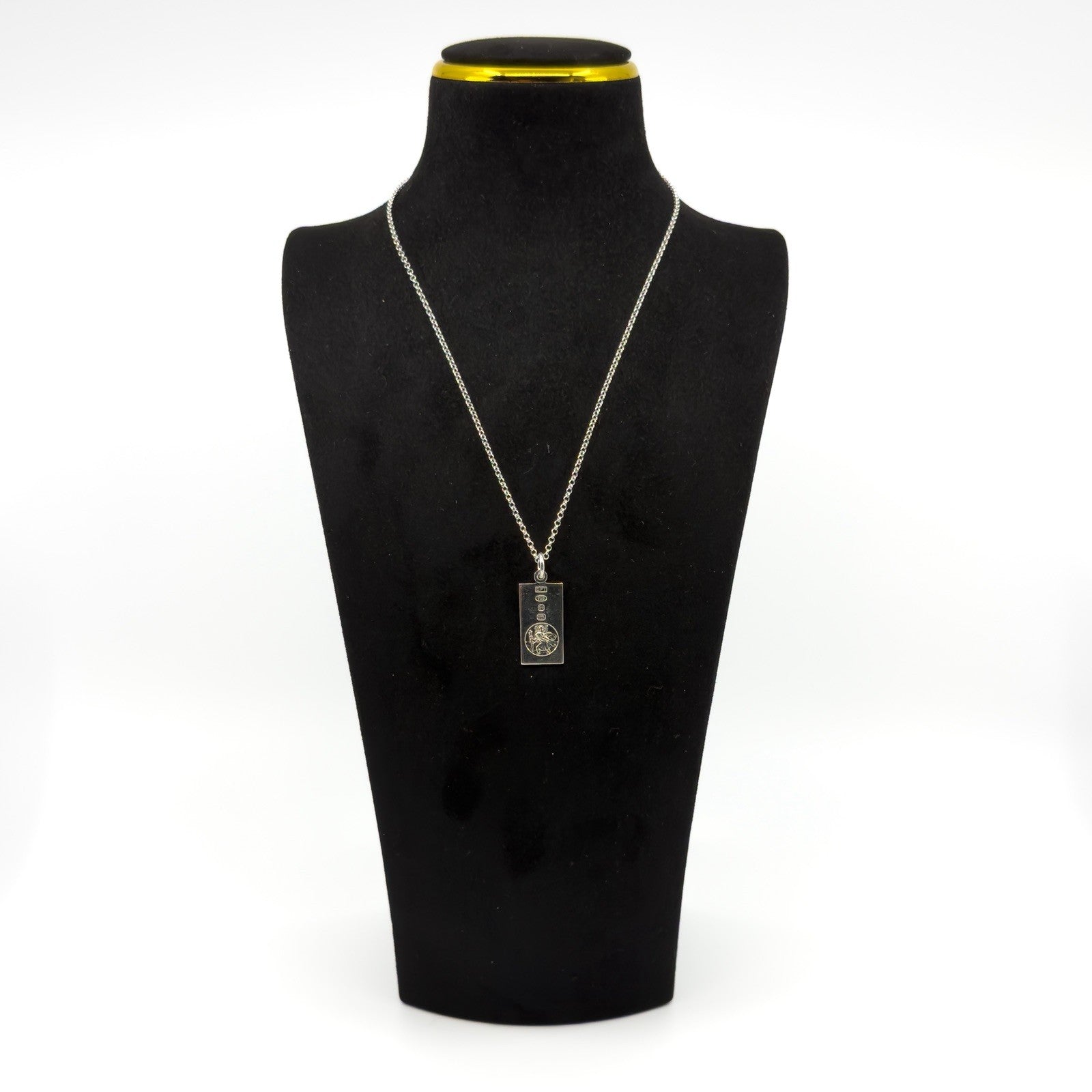 Sterling silver St Christopher ingot pendant shown on an 18 inch chain on a black display bust