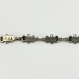 Reverse of the sterling silver St Johns Ambulance watch chain showing stamped number 262324 on linked award bars.