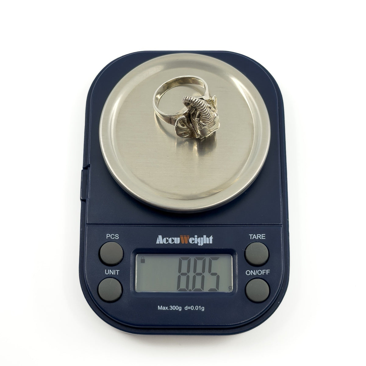 Vintage sterling silver elephant locket ring on digital scales showing approx. 8.85g weight