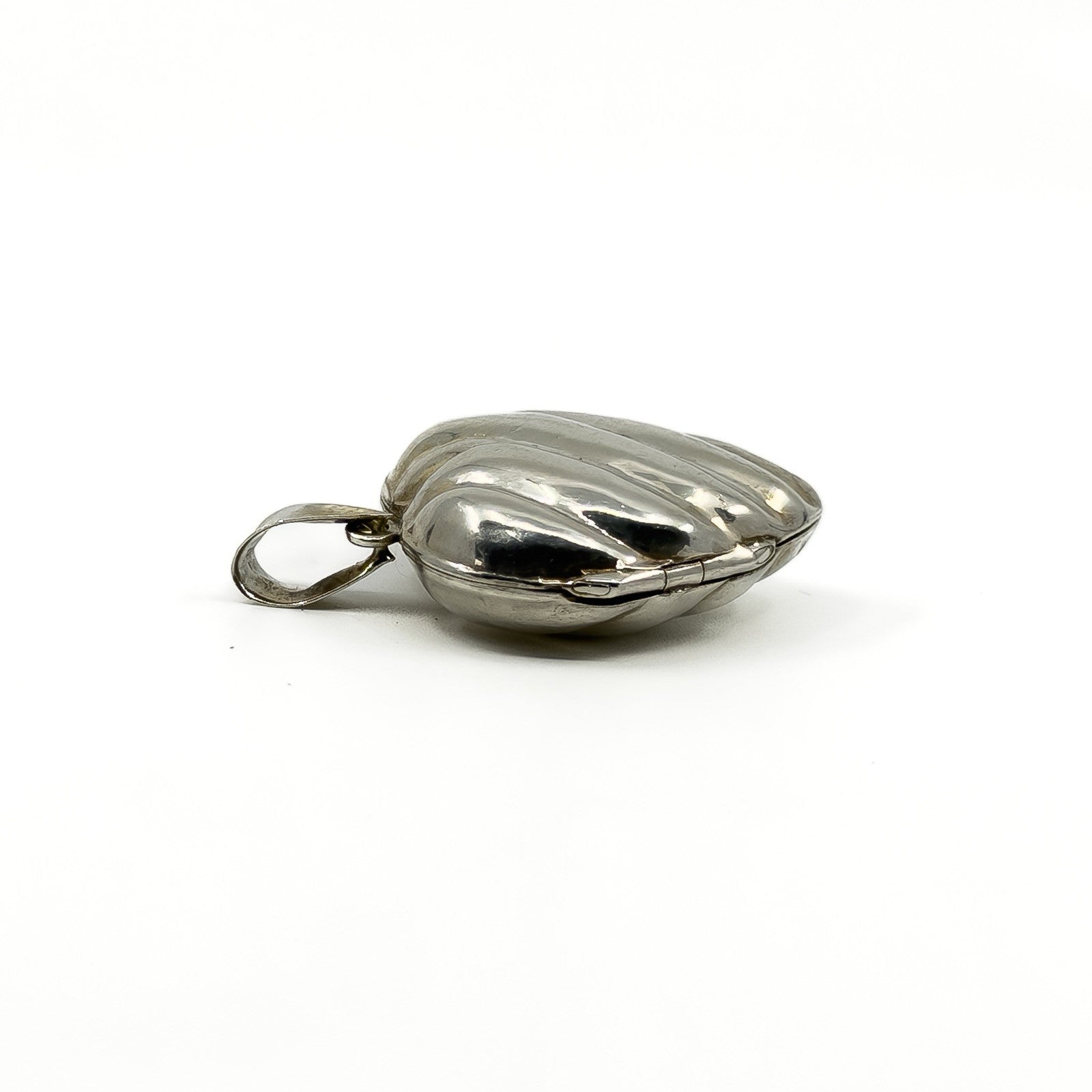 Side view of the vintage sterling silver puffy heart locket with large bail.