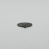 Side view of vintage sterling silver St Christopher pendant charm showing the jump ring fitting.