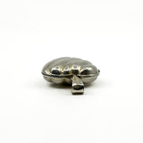 Low side view of the sterling silver puffy heart photo locket showing the rounded puffy shape.