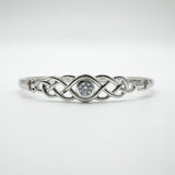 Symmetrical front view highlighting the brilliant-cut CZ in centre setting