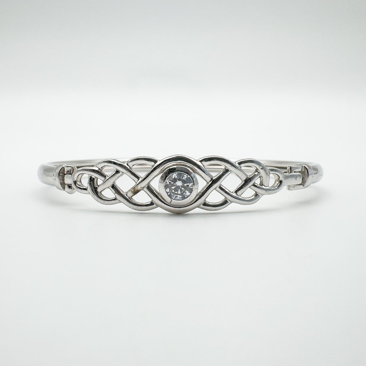 Symmetrical front view highlighting the brilliant-cut CZ in centre setting