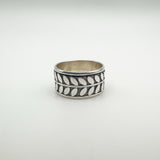 Sterling silver band ring with repeating leaf motif design