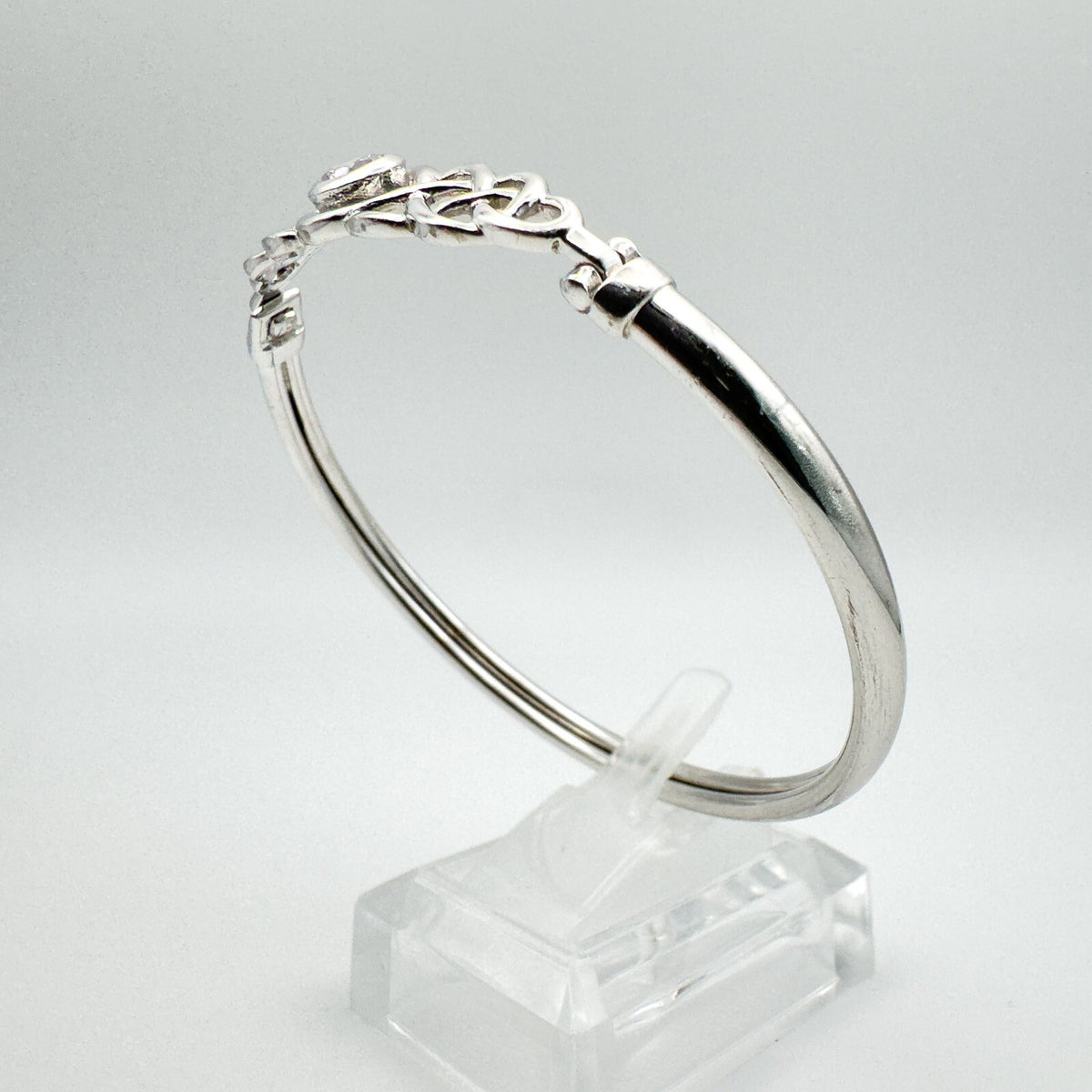 Overhead view highlighting the oval shape and slim silver band