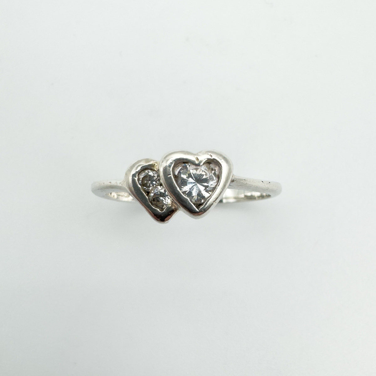 Top view showing 0.20ct CZ stones in a double heart setting