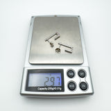 Digital scale showing total weight of sterling silver J hoop earrings as 2.97g