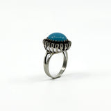 Raised side view of the sterling silver turquoise and diamond halo ring