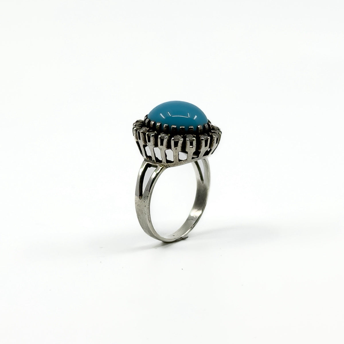 Raised side view of the sterling silver turquoise and diamond halo ring