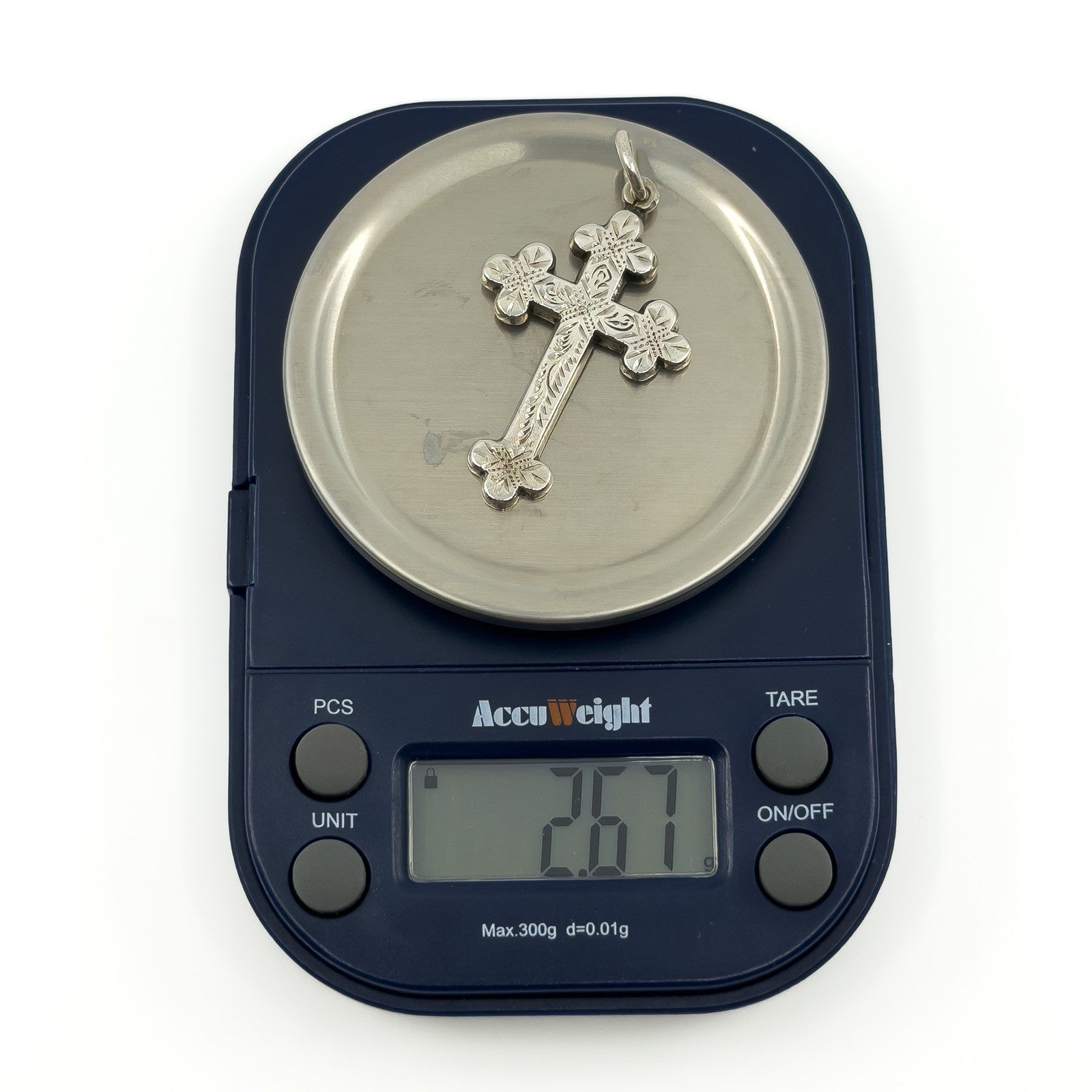 Antique Victorian sterling silver cross pendant shown on digital scales weighing approximately 2.67g