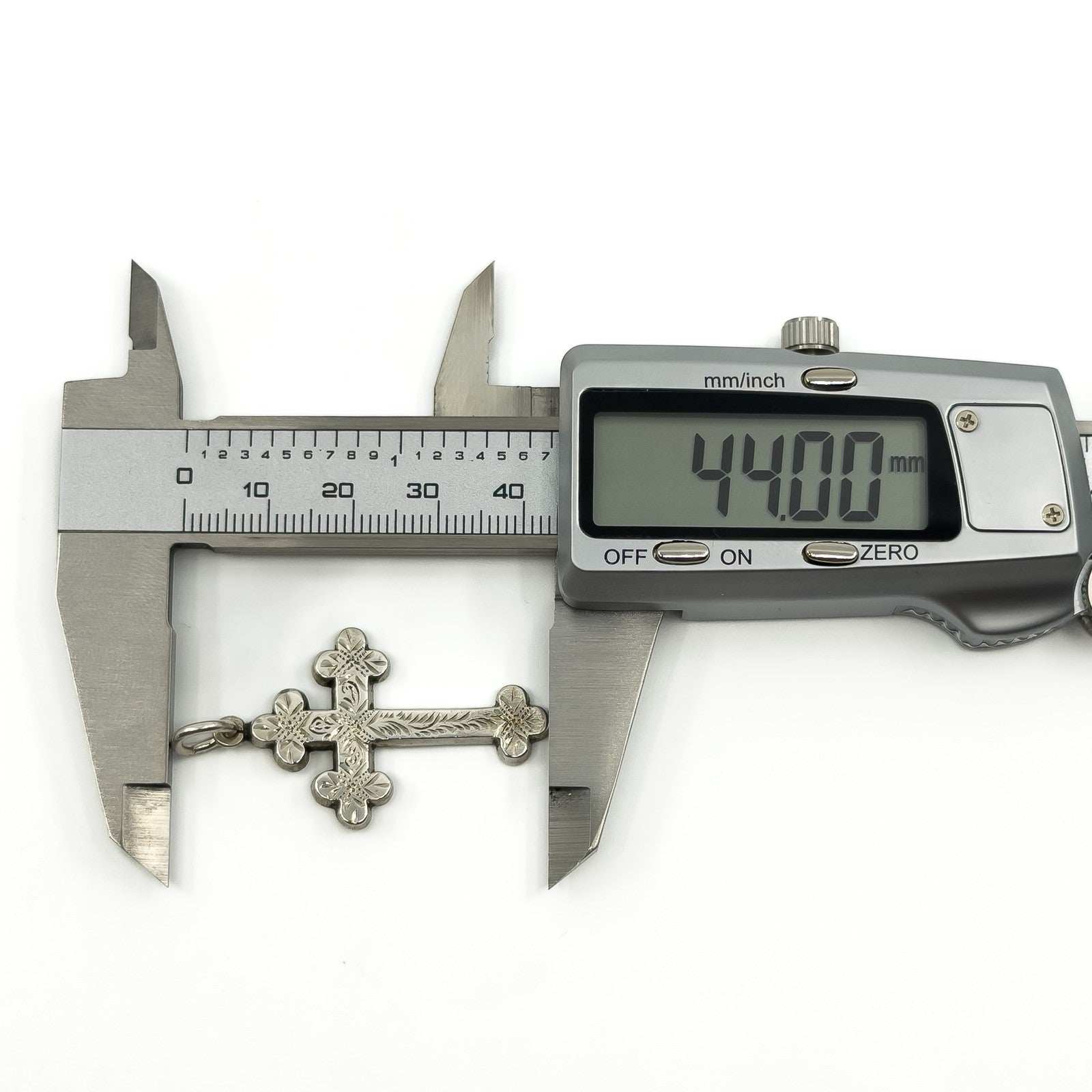 Antique Victorian silver cross pendant measured at approximately 44mm long with digital calipers