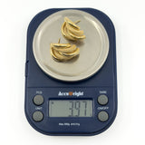 Pair of vintage 9ct gold chunky half hoop earrings shown on digital scales weighing approximately 3.97g.