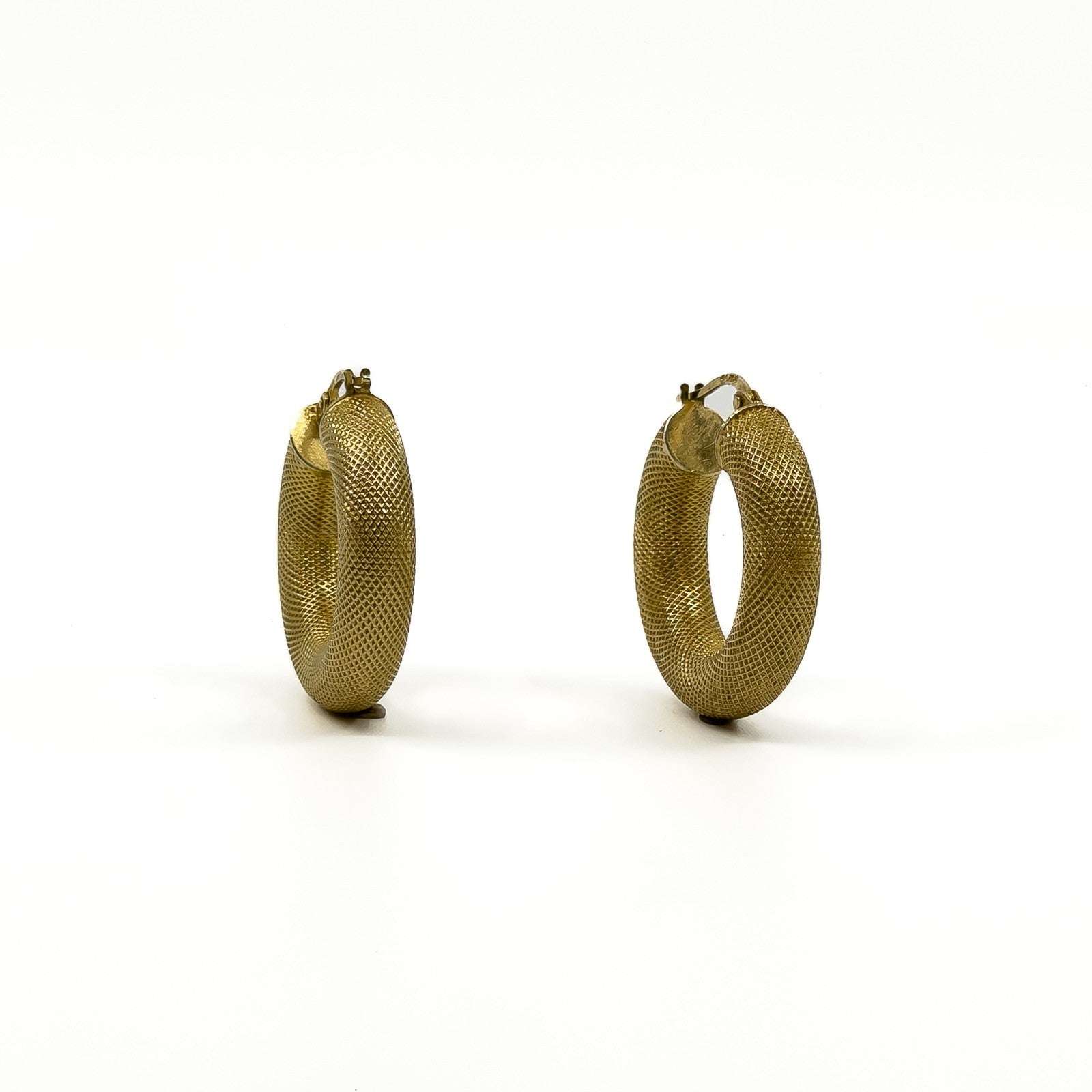 Side view of vintage 9ct gold mesh hoop earrings showing rounded profile