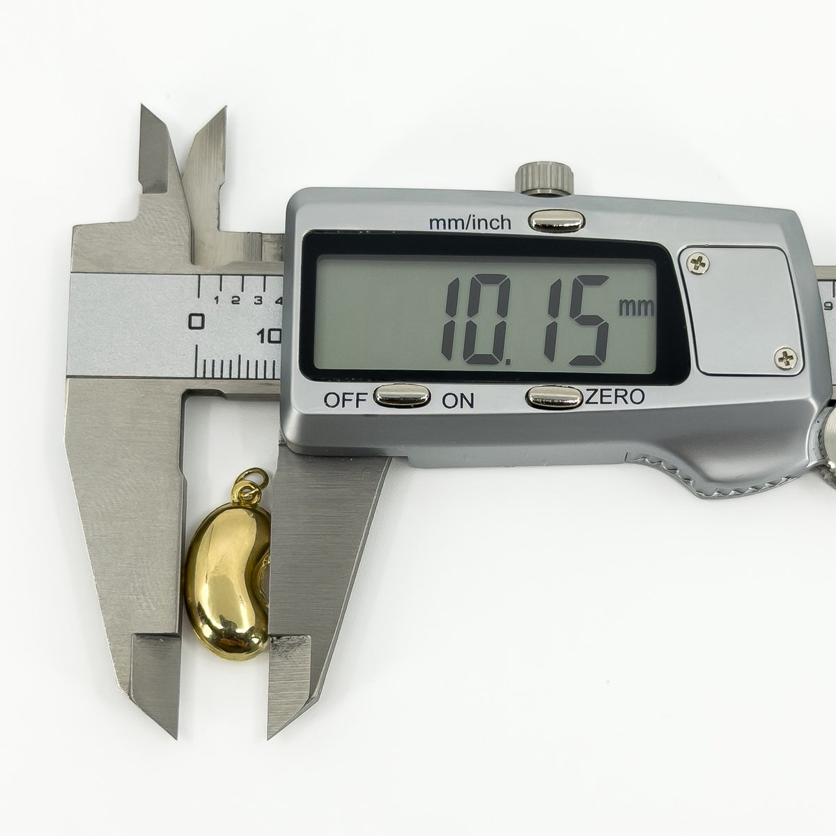 Vintage 9ct gold lucky bean charm pendant measured at approximately 10.15mm wide with digital calipers.