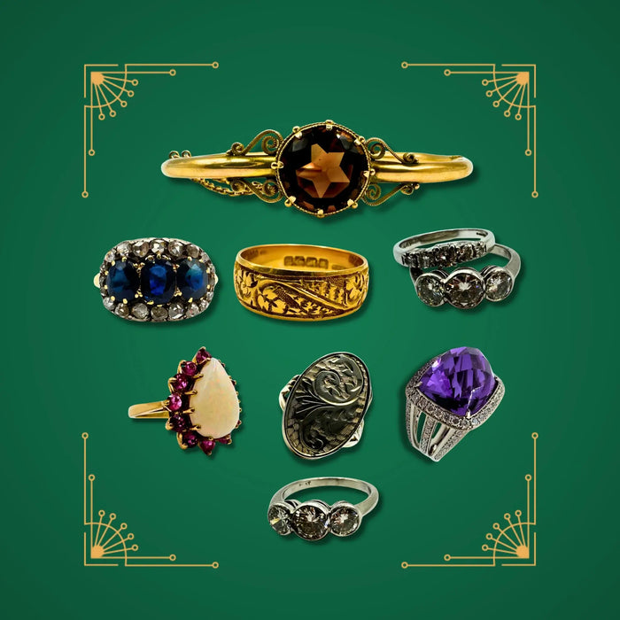 Vintage gemstone rings banner showing gold, silver and platinum rings with amethyst, sapphire, opal and diamond designs.