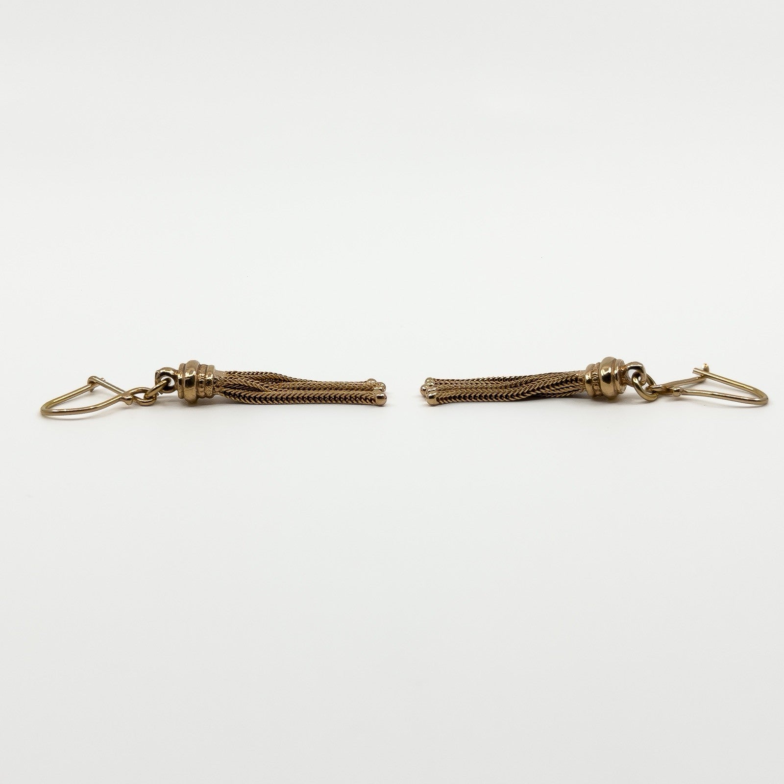 Side view of the vintage 9ct rose gold tassel earrings showing the articulated Albertina chain drops.