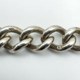 Close-up of sterling silver curb links showing 925 hallmarks