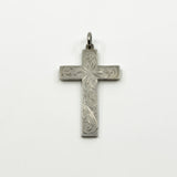 Vintage sterling silver cross pendant with engraved foliate detail and a plain bail.