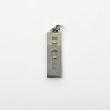 Hallmark close up on vintage sterling silver ingot pendant with Birmingham 1977 marks