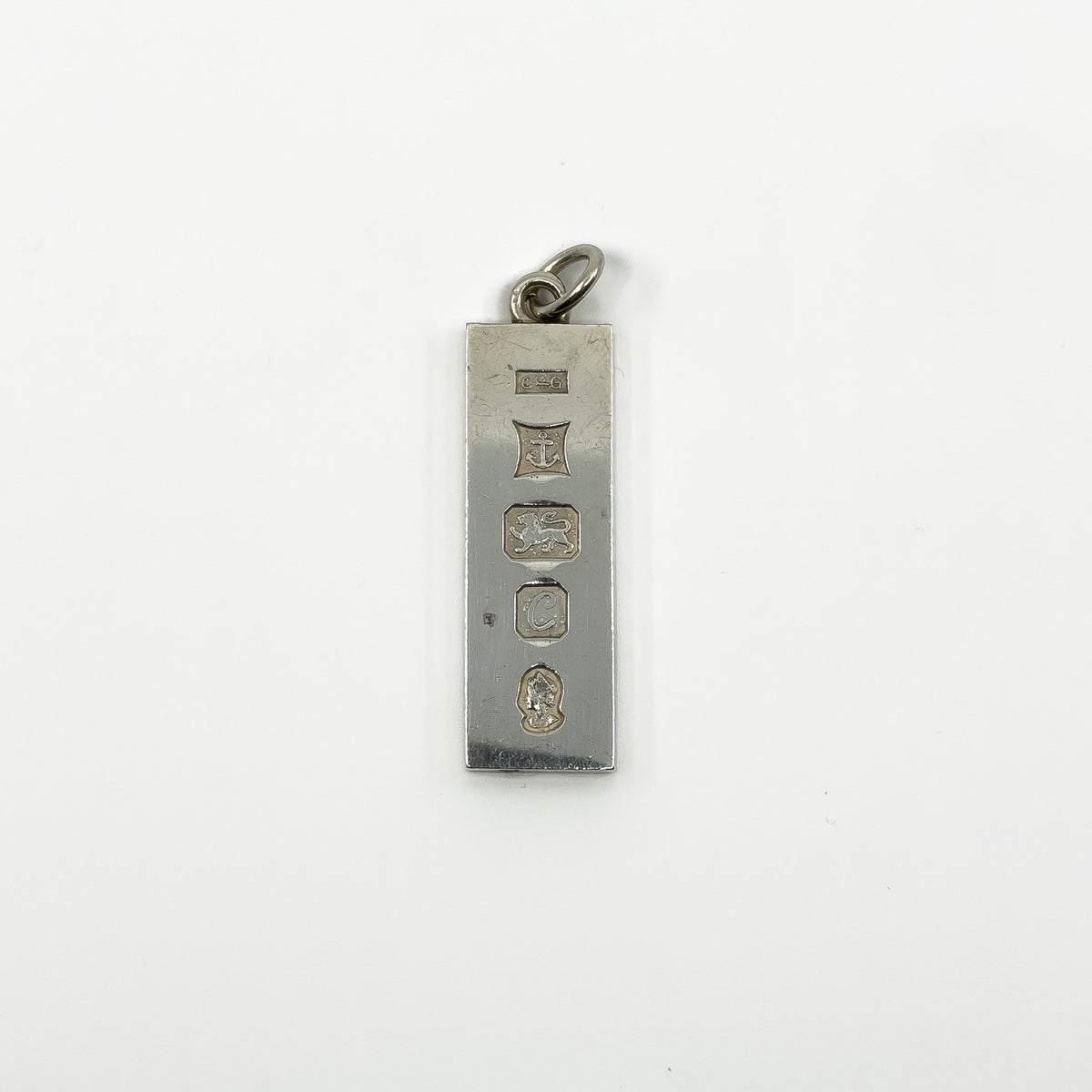 Hallmark close up on vintage sterling silver ingot pendant with Birmingham 1977 marks