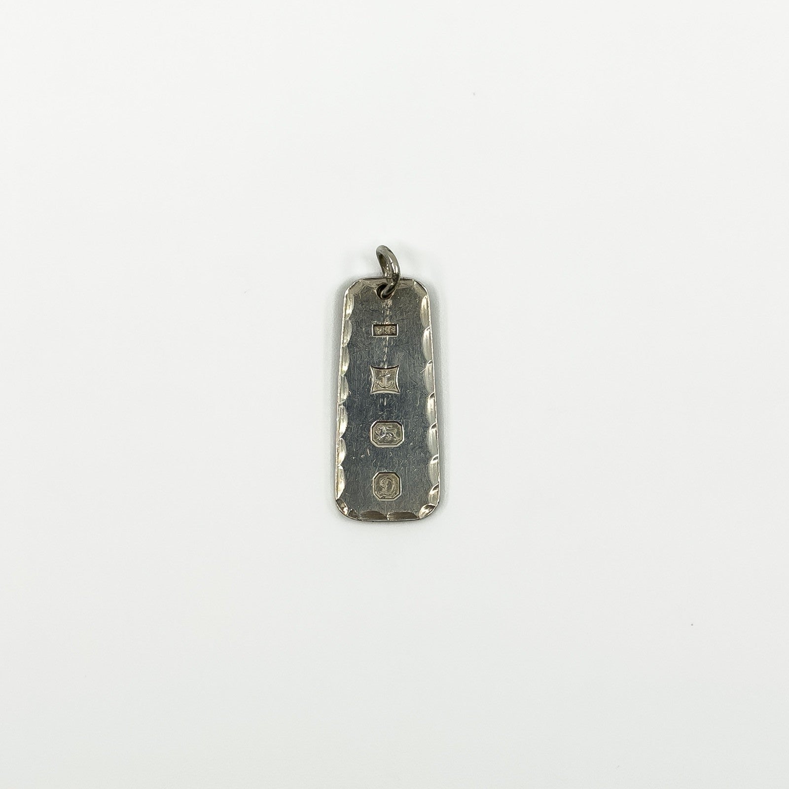 Vintage sterling silver ingot pendant showing Birmingham 1978 hallmarks on the reverse.