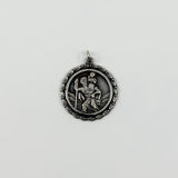 Vintage sterling silver St Christopher pendant charm with jump ring on white background.