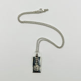 Vintage sterling silver St Christopher ingot pendant with 18 inch chain laid flat
