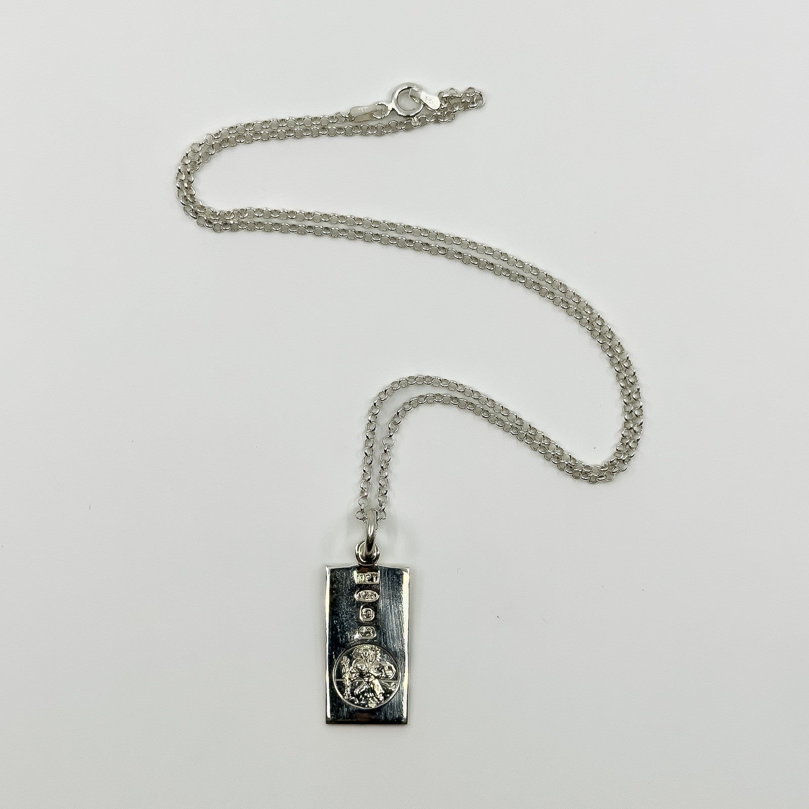 Vintage sterling silver St Christopher ingot pendant with 18 inch chain laid flat