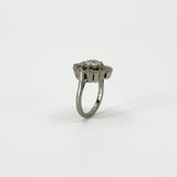 Side profile of vintage platinum diamond cluster ring showing the elevated cluster setting and platinum band.