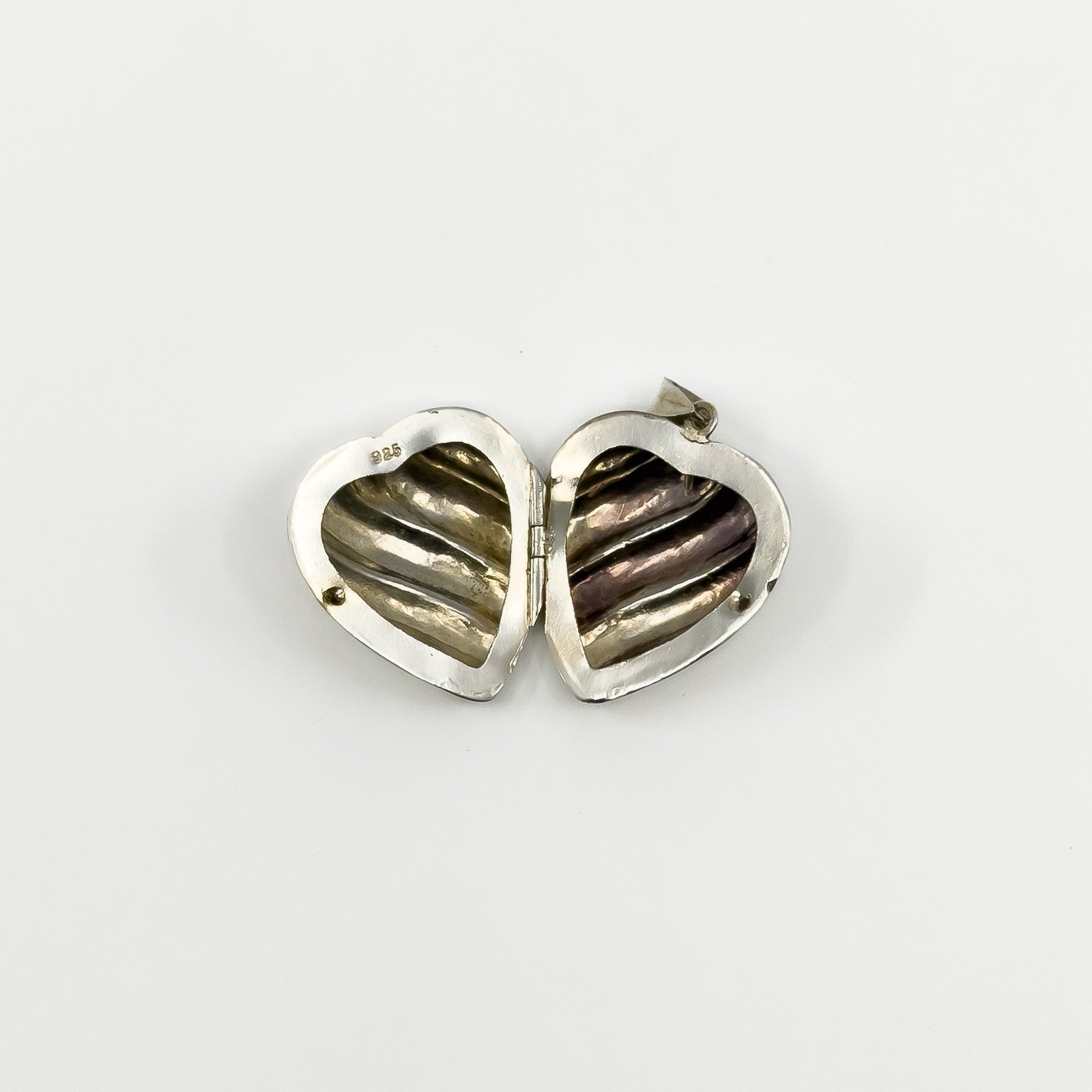 Inside view of the vintage sterling silver puffy heart photo locket with 925 stamp.